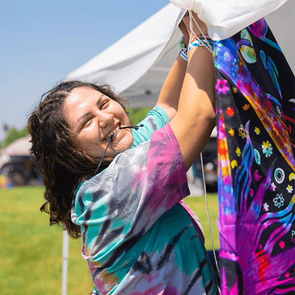 attendee setting up tent