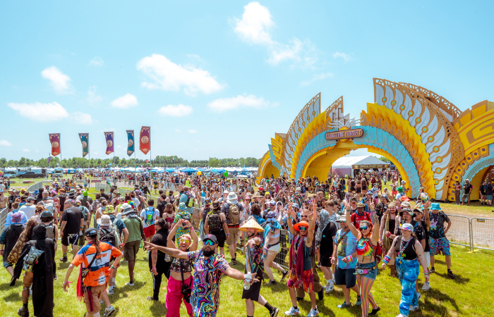 attendees frolicking through the forest